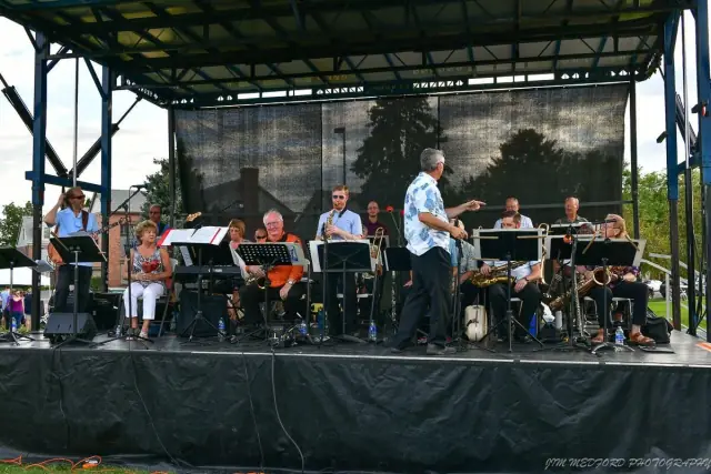 The ten-piece Denver Municipal jazz band performing in a park