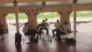 A brass quintet playing at an event